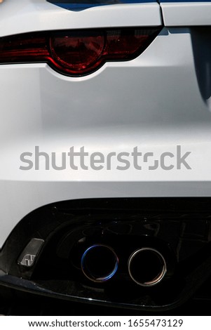 Back car Lights close up. White sports car closeup. Jaguar F-type