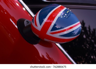 Back of a car side mirror displaying  British flag