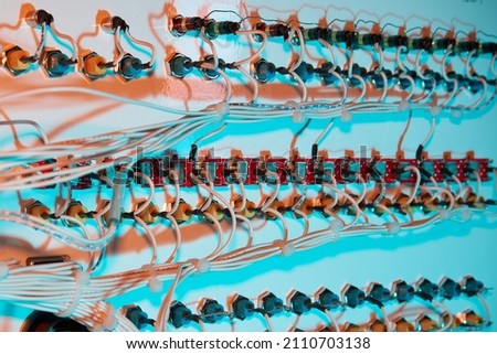 Back of complex avionics test panel with switches and test ports