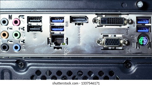back of the computer with different connectors for cords