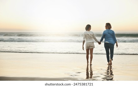 Back, couple and walking in water, lesbian and holding hands of women, vacation and love in beach. Summer, travel and waves in sea, holiday and peace of people, lgbtq and trust in adventure of date