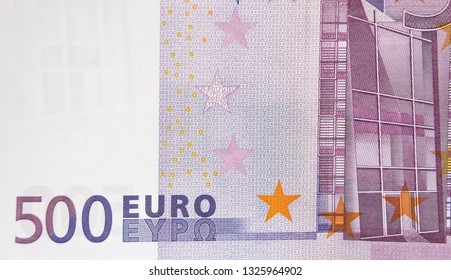 The back detail of the 500 Euro bill. It shows the image of a window or building and some stars