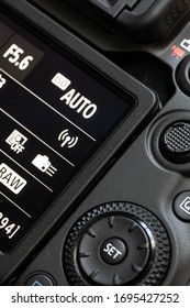 The back of digital camera with control buttons and display, close up.