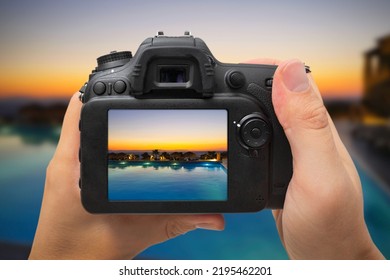 Back of DSLR digital camera. Camera with swimming pool and sunset, travel photo