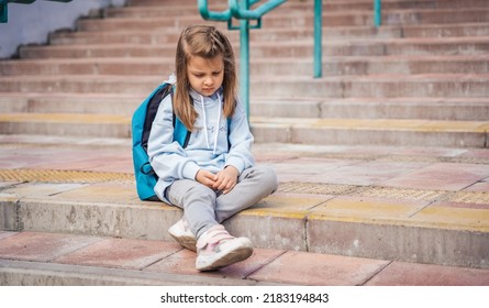 Back To Elementary, Primary School. Little Sad Girl With Big Backpack Goes In Hurry, Late To First Grade Alone In Autumn Morning. Education, Future Of Children. Happy,unhappy Pupil Kid On Stair Steps.