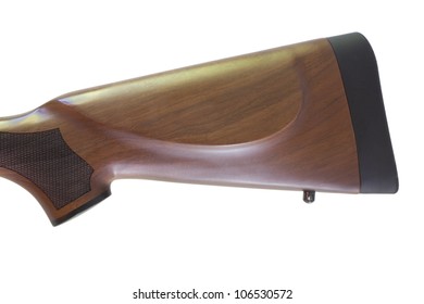 Back End Of A Rifles Stock Along With A Black Recoil Pad