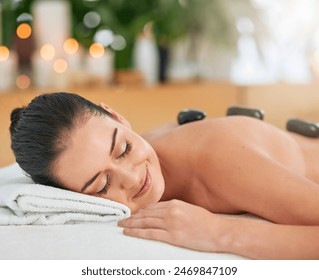 Back, face and hot stone massage with woman in spa to relax for health, peace or wellness. Beauty, calm and stress relief with body of customer in clinic or salon for natural healing treatment - Powered by Shutterstock