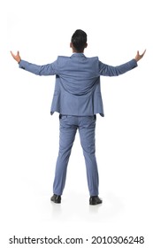 Back Full Body Portrait Of Young Handsome Business Man In Gray Suit  Standing With His Arms Raised Up Against A Background 

