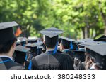 Back of graduates during commencement at university. Close up at graduate cap