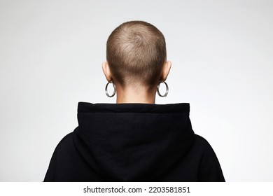 Back Of The Head. Girl With Short Haircut. Back Of Bald Woman With Earrings. Art Portrait