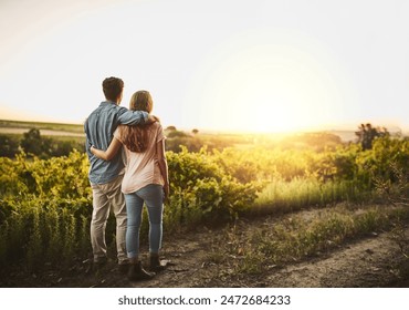 Back, hug and couple in sunrise, field and together with care, love and date for anniversary in outdoor. Morning, partner and person with embrace, nature and peace in grass and relax in Texas in farm - Powered by Shutterstock