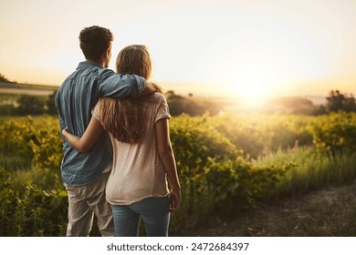 Back, hug and couple in sunrise, park and together with care, love and date for anniversary in outdoor. Morning, partner and person with embrace, nature and peace in field and relax in Texas in farm - Powered by Shutterstock