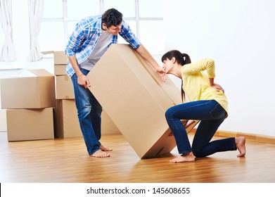 back injury from carrying heavy box while moving home - Powered by Shutterstock