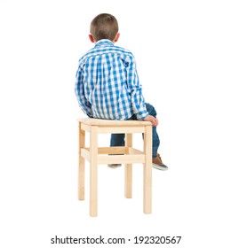 Back Kid On Wooden Chair Over White Background