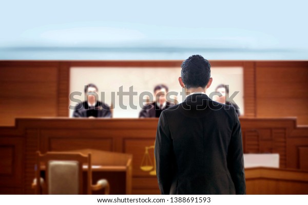 back of lawyer talking to attorney in\
courtroom . The legal adjustment trail justice concept. Lawyer is\
famous occupation of high performance in political judgment in\
human relation rule in\
seriously.