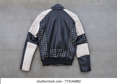 Back Of Leather Punk Rivets Jacket Hanging-gray Background

