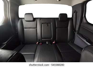 Back leather seat of modern pickup car interior with isolated windows