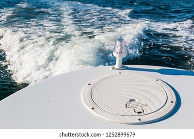 Back Light On The Stern Of A Boat With Wake.