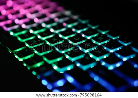 Back lighted computer gaming keyboard with versatile color schemes.