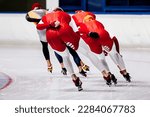 back male skaters running mass start speed skating race, winter sports competition