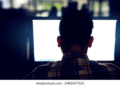 Back, man and computer screen in office at night as developer for software development, coding and working late. Programmer, mockup pc and process script, firewall update and IT for data protection