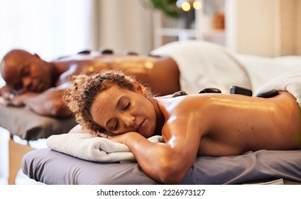 Back massage, spa stone and relax couple in luxury wellness for zen therapy, beauty and skincare. Calm, peace and sleeping people on salon bed for healthy stress relief or happy holistic body detox - Powered by Shutterstock