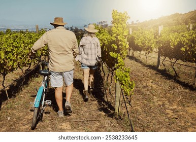 Back, mature couple and walk in vineyard for countryside, travel and holiday with bicycle. Senior people outdoor, adventure and bonding for retirement together with landscape, tour and sightseeing - Powered by Shutterstock