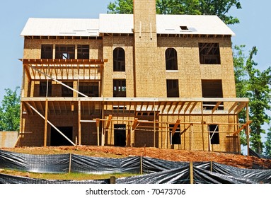 Back Of A New Home Under Construction Showing The Rows Of Silt Barriers.