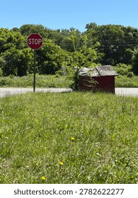Back of an old red shack, or hydrant house