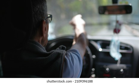 Back Of Older Man Driving On Road. Senior Driver On Trip