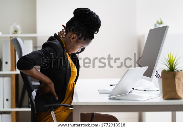 Back Pain Bad\
Posture Woman Sitting In\
Office