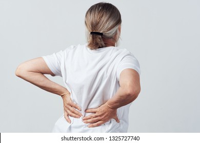 Back Pain Elderly Woman Rear View                               