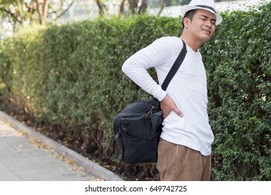 Back Pain Man Carrying Heavy Bag