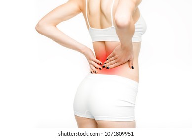 Back pain, woman with backache on white background. Female person in white lingerie, medical advertising or concept