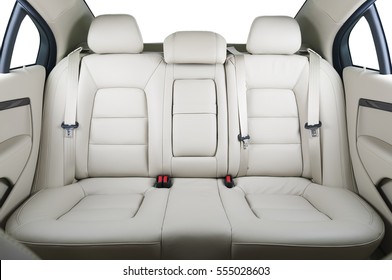 Back passenger seats in modern luxury car, frontal view, white leather