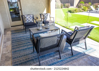 Back Patio With Four Arm Chairs And Coffee Table On Decorator Rug