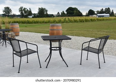 A Back Patio View Of Wine Barrels Overlooking A Vineyard Landscape In Michigan, USA