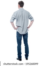 Back pose, full length shot of a young man looks ahead