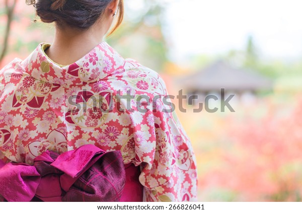 Back of a pretty Japanese girl in beautiful\
atmosphere. This picture has soft\
focus.