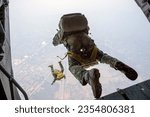 The back of Rangers parachuted from military airplanes, Thai Soldiers parachuted from the plane, isolated airborne soldier, practice parachuting, Paratroopers jumping from an airplane.