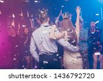 Back rear photo of charming lovers mates raise hand wear dress suit formalwear disco discotheque high-school event