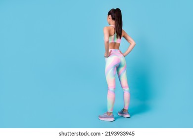 Back Rear Spine Photo Of Determined Lady Stand Look Copyspace Wear Rainbow Print Sport Suit Isolated Blue Color Background