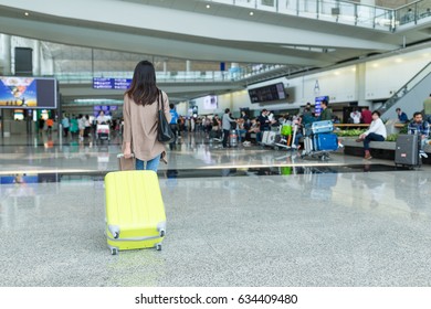 Back Rear View Of Woman In Airport