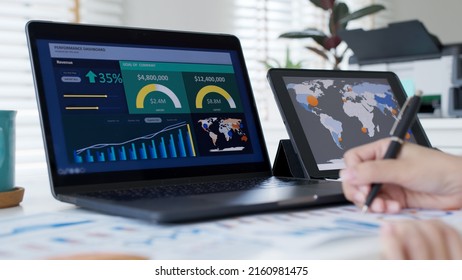 Back rear view of young asian woman, freelance data scientist work remotely at home coding programmer on Big data mining, AI data engineering, IT Technician Works on Artificial Intelligence Project.