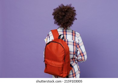 Back Rear View Of Young Girl Woman Of African American Ethnicity Teen Student In Shirt Backpack Isolated On Pastel Plain Purple Color Background. Education In High School University College Concept