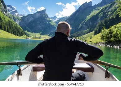 Back Of Rower In Front Beautiful Seealpsee Lake And Alpstein Mountain In Appenzell, Switzerland