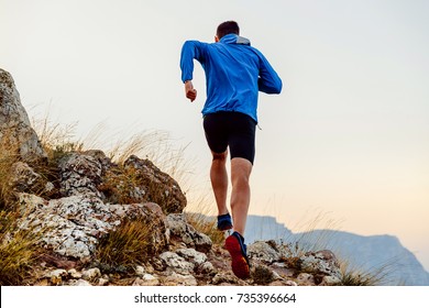 Back Runner Man Athlete Running Uphill Trail Over Stones