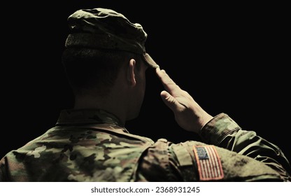 Back, salute and army with a soldier in uniform on a dark background in studio for service or duty as a patriot. Military, respect and america marine or war veteran from behind, ready for battle - Powered by Shutterstock