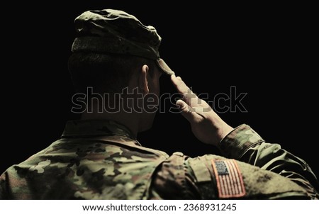 Back, salute and army with a soldier in uniform on a dark background in studio for service or duty as a patriot. Military, respect and america marine or war veteran from behind, ready for battle
