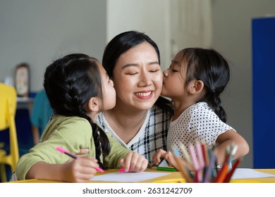 Back to School. Affectionate moment between a teacher and her students during art class. - Powered by Shutterstock - Get 15% off with code: PIKWIZARD15